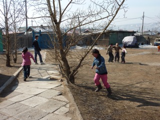 Children playing outside during the break